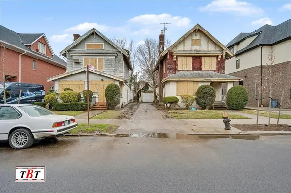 a car parked in front of a house