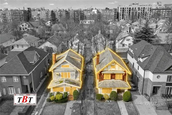 an aerial view of residential houses with outdoor space