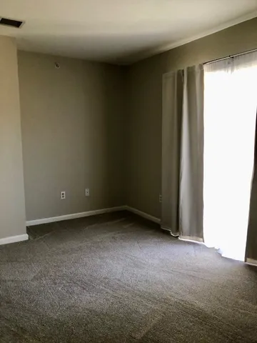 a view of a city that has parked cars