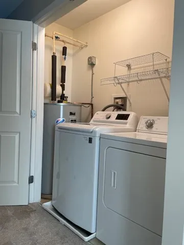 a white toilet sitting next to a bath tub