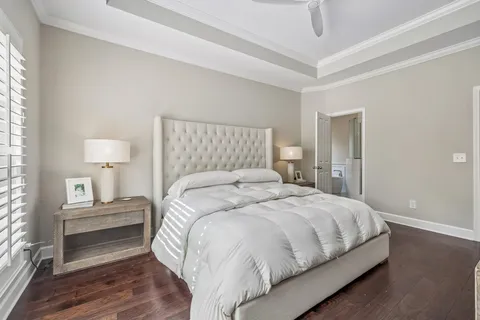a bedroom with a bed and a night stand