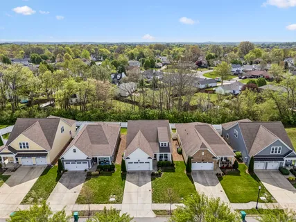 an aerial view of house with yard