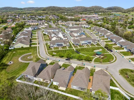 an aerial view of residential house with outdoor space and pool