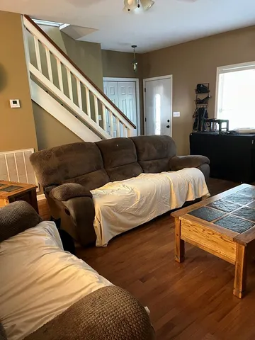 a living room with furniture and a table