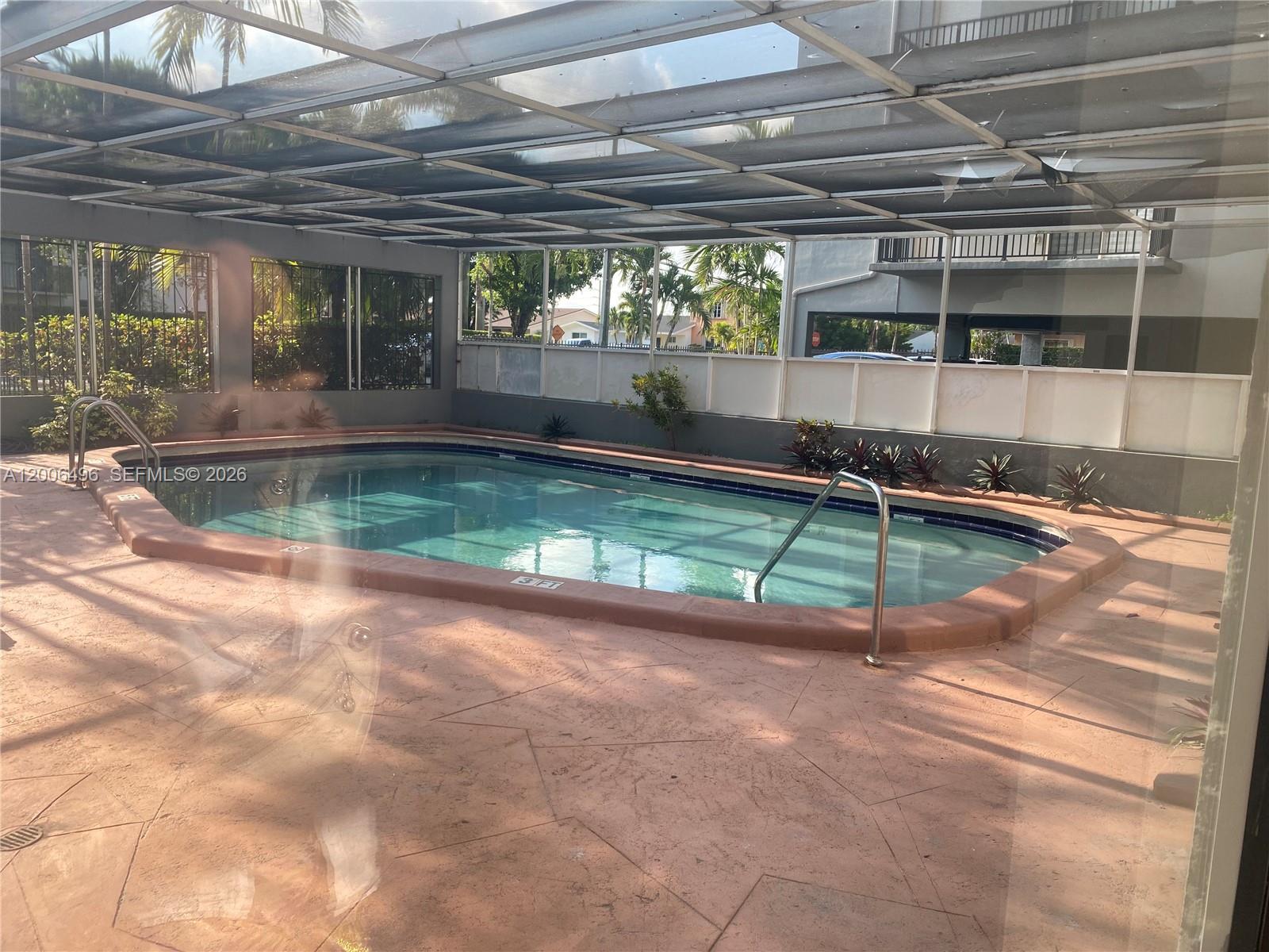 900 Southwest 84th Avenue, Unit 415D Miami, FL 33144 - Photo 18 of 19 a view of a backyard