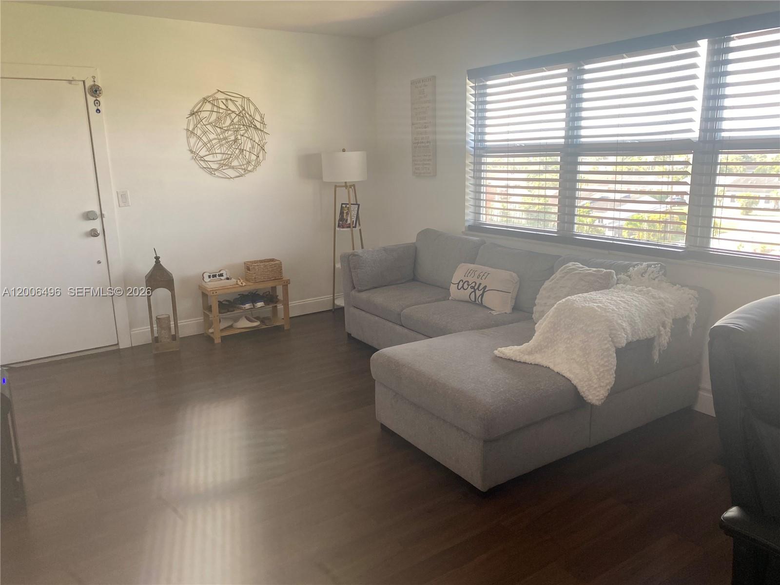 900 Southwest 84th Avenue, Unit 415D Miami, FL 33144 - Photo 3 of 19 a living room with furniture and a window