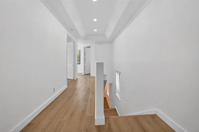 a spacious bedroom with a bed and a table in it