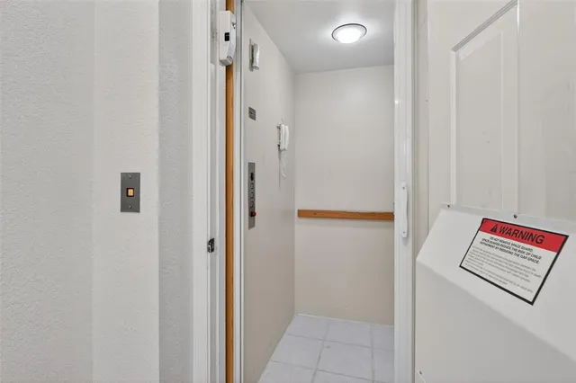 an empty room with sliding glass door and glass door