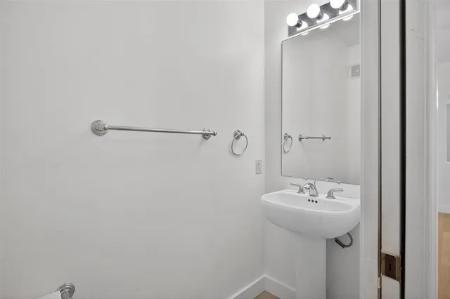 a balcony with furniture and wooden floor