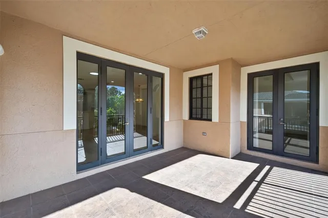 a view of a kitchen with a sink dishwasher a refrigerator and wooden floor