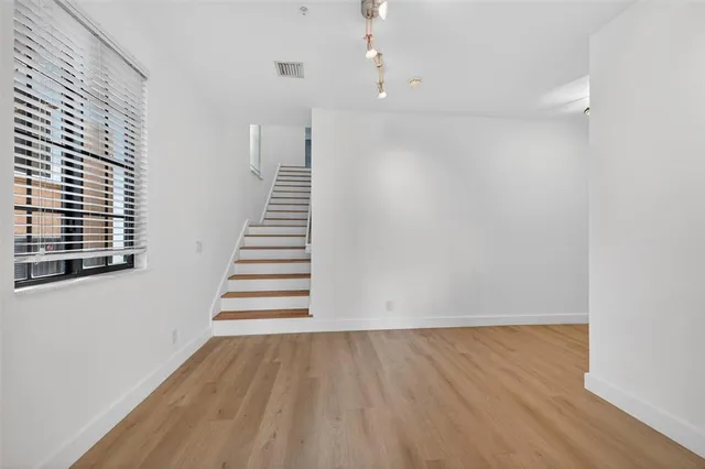 a view of entryway with wooden floor