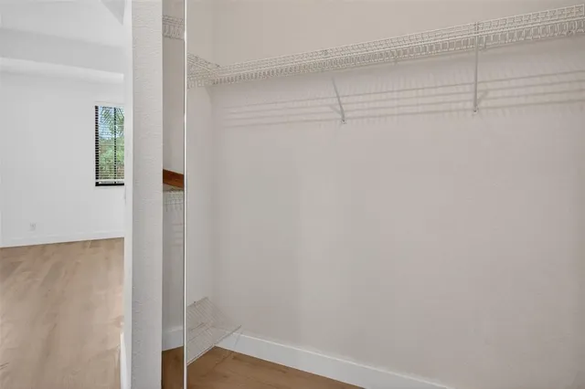 a view of a porch with furniture and a potted plant