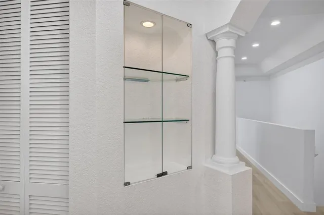 a view of a lake with houses in the back