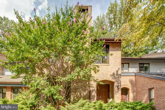a view of a livingroom with an empty space and wooden floor