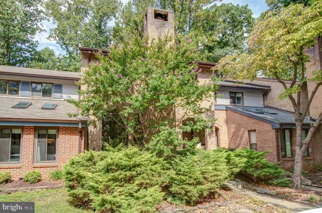 front view of a house with a tree
