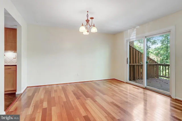 a bathroom with a granite countertop sink a mirror and shower
