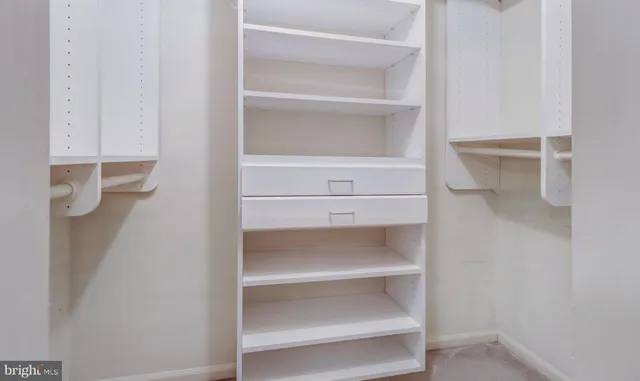a bathroom with a toilet sink and a mirror