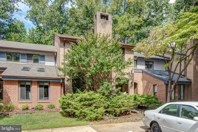 a view of a car parked in front of a house