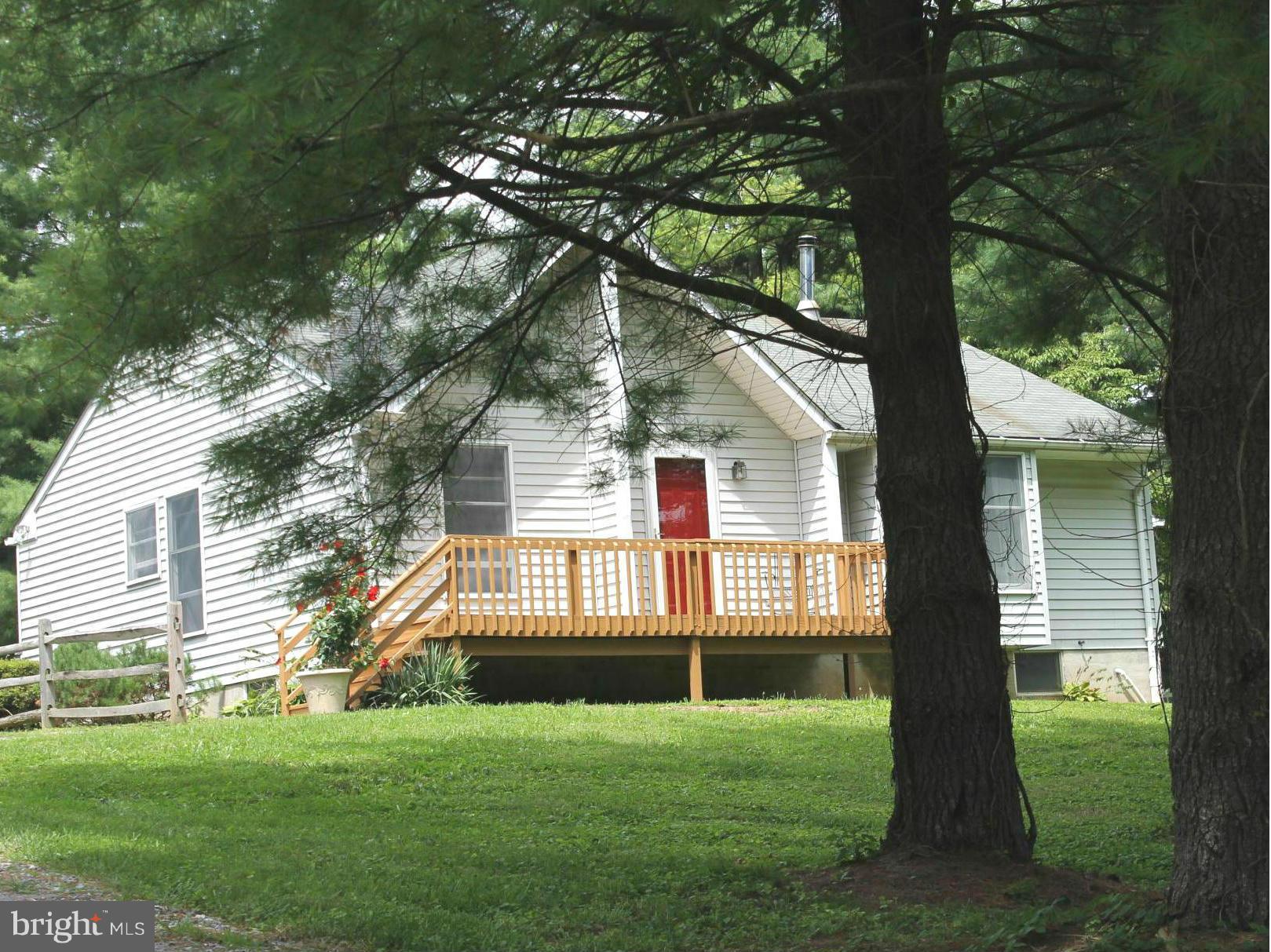 15405 Dover Road Upperco, MD 21155 - Photo 1 of 22 a front view of a house with a yard