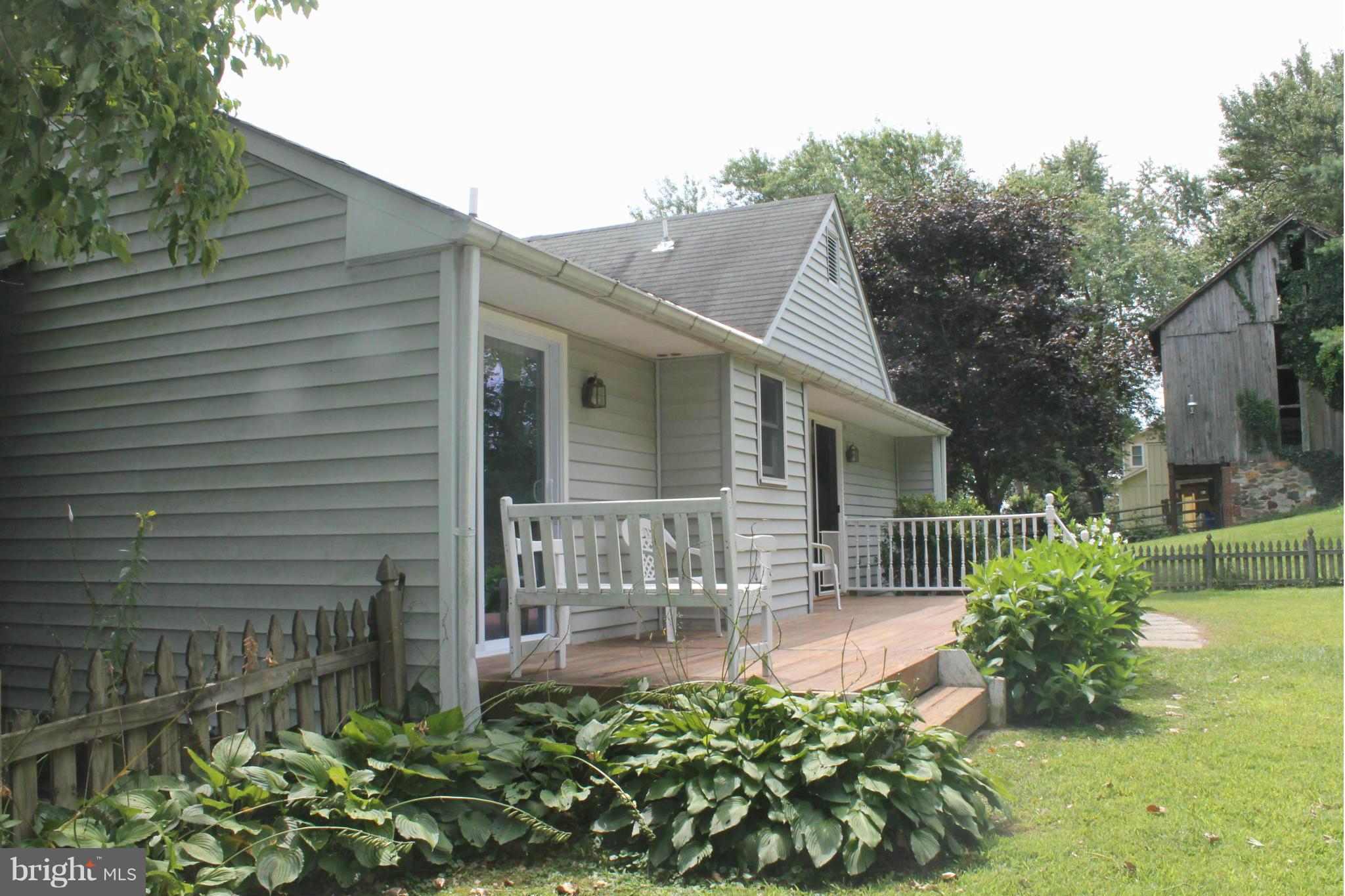 15405 Dover Road Upperco, MD 21155 - Photo 20 of 22 a front view of a house with garden