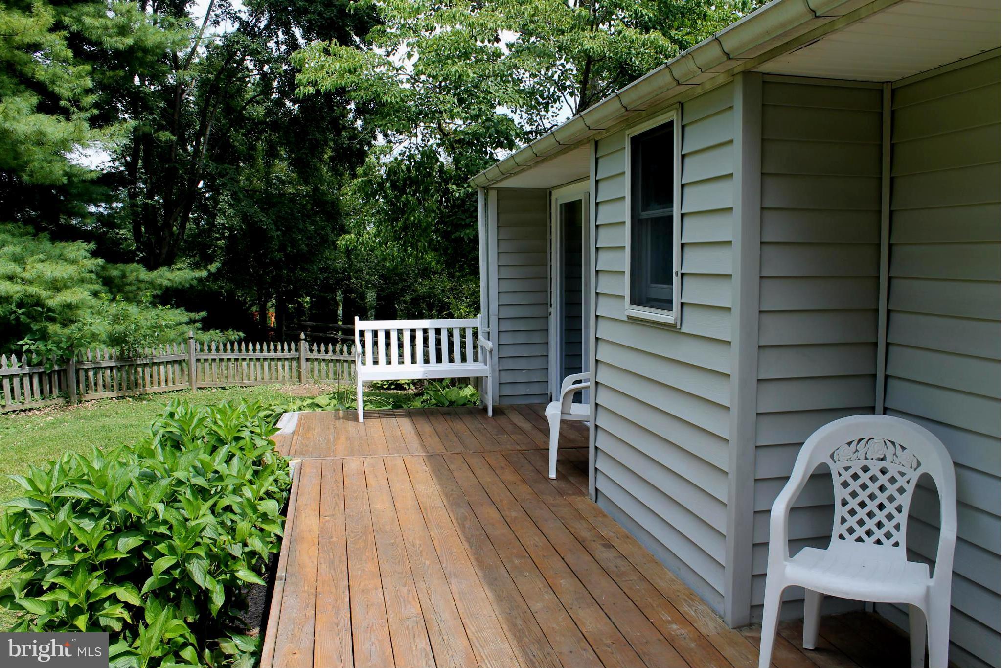 15405 Dover Road Upperco, MD 21155 - Photo 4 of 22 a view of backyard with a garden and deck