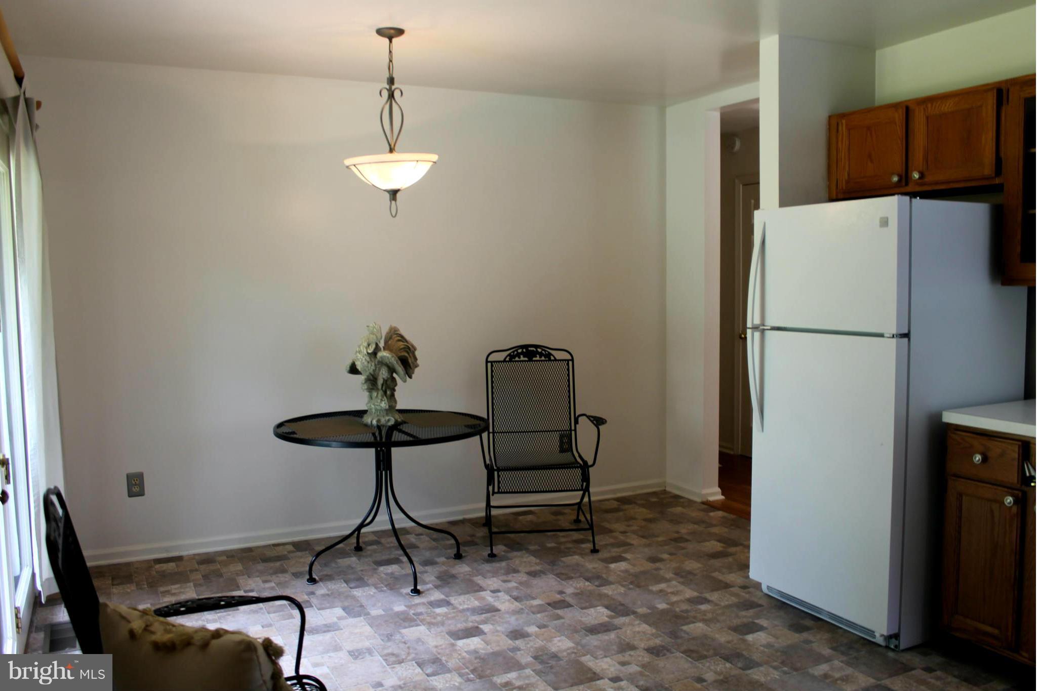 15405 Dover Road Upperco, MD 21155 - Photo 6 of 22 a dining room with furniture and a chandelier
