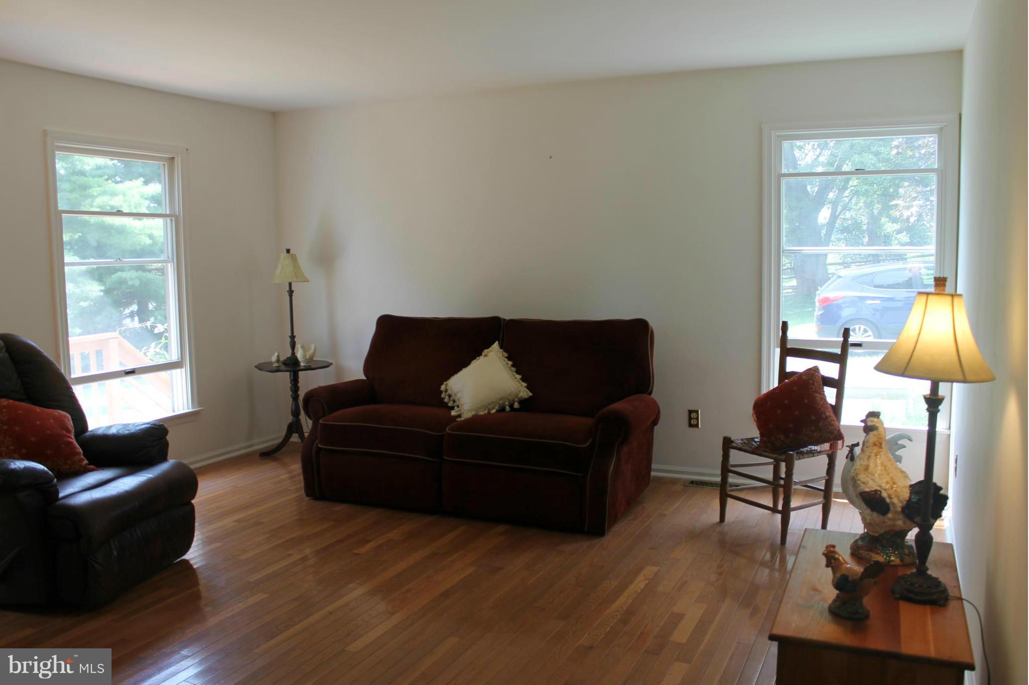 15405 Dover Road Upperco, MD 21155 - Photo 8 of 22 a living room with furniture and a lamp