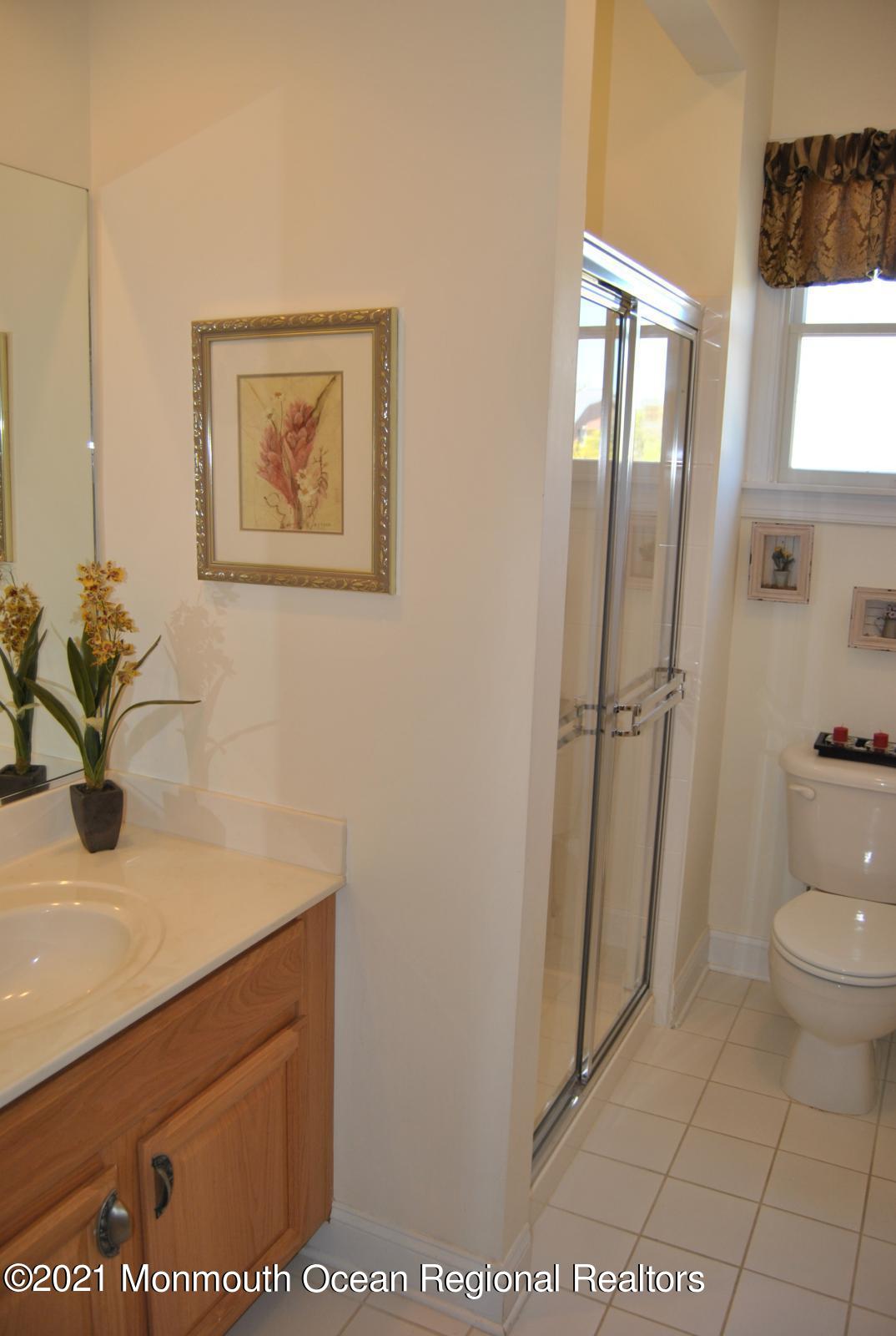 2 Hanging Rock Road Freehold, NJ 07728 - Photo 17 of 55 a bathroom with a sink a toilet and a mirror