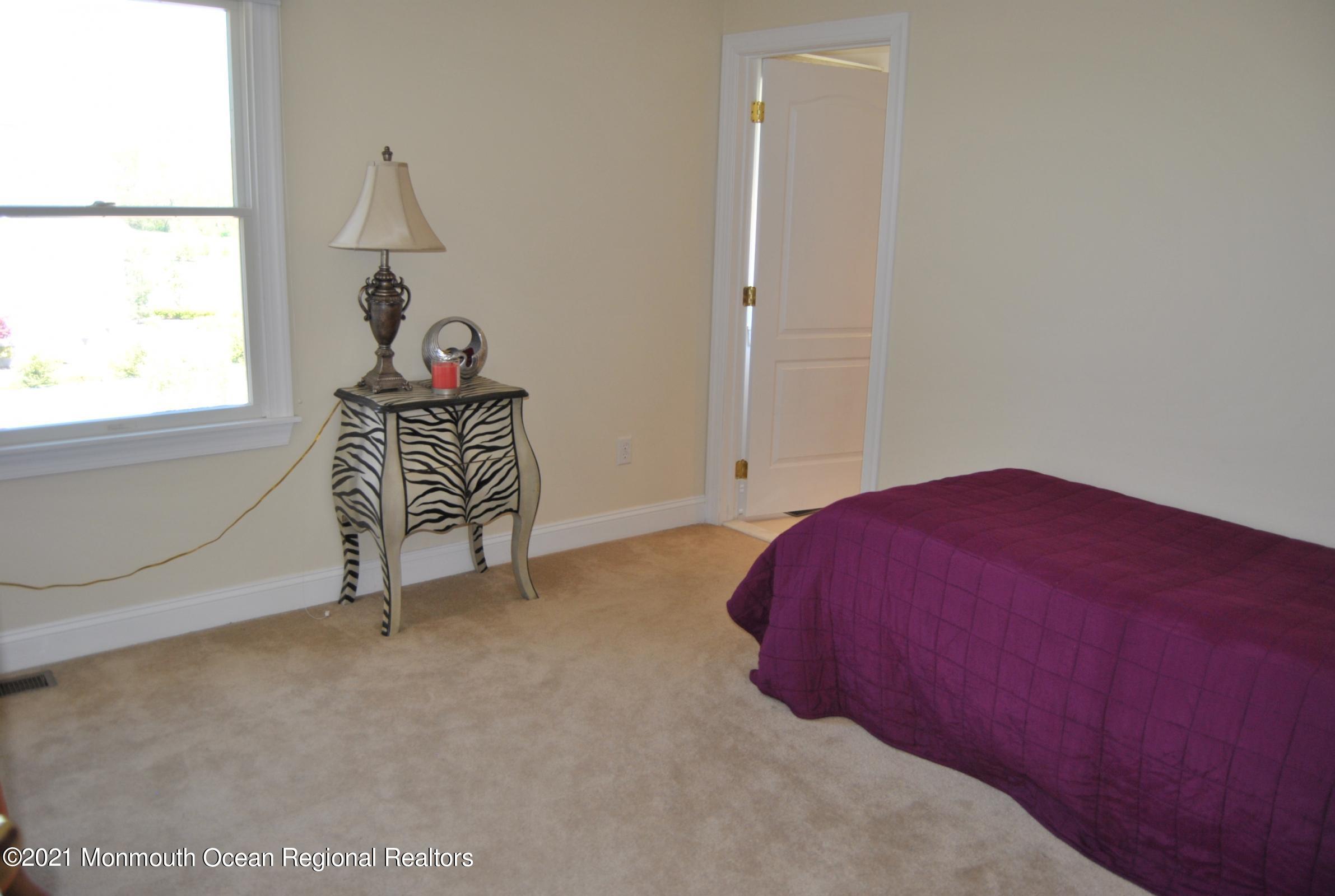 2 Hanging Rock Road Freehold, NJ 07728 - Photo 21 of 55 an empty room with windows and fan