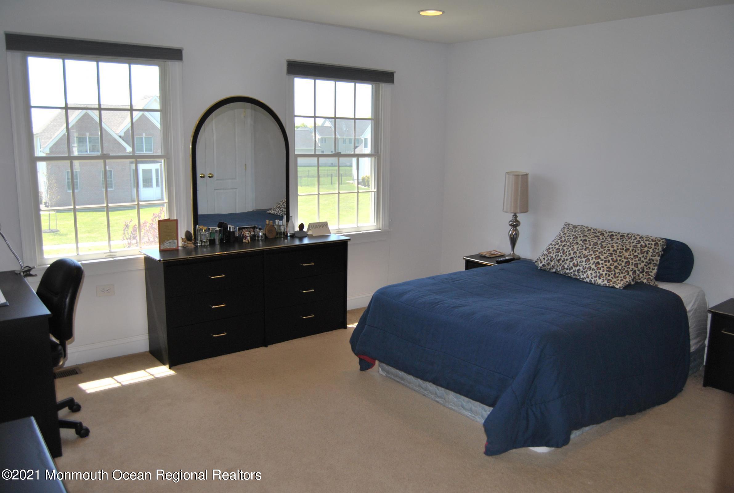 2 Hanging Rock Road Freehold, NJ 07728 - Photo 23 of 55 a bedroom with a bed and a windows