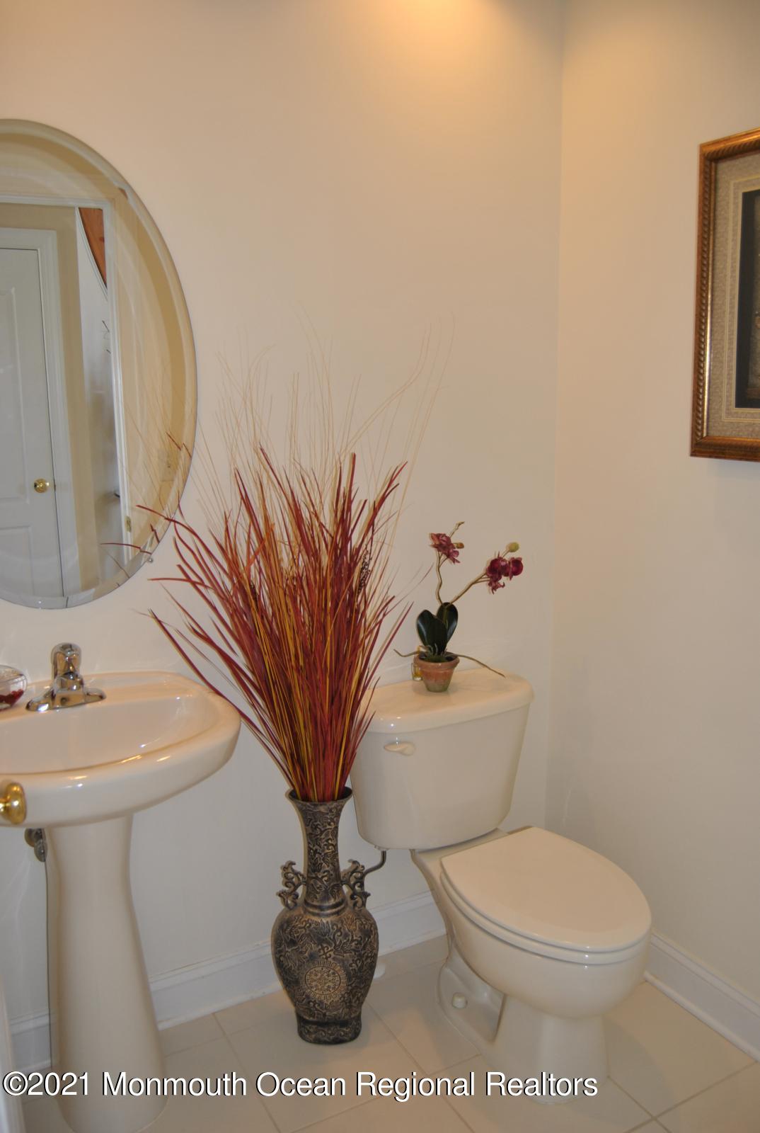 2 Hanging Rock Road Freehold, NJ 07728 - Photo 24 of 55 a bathroom with a toilet a sink and a mirror