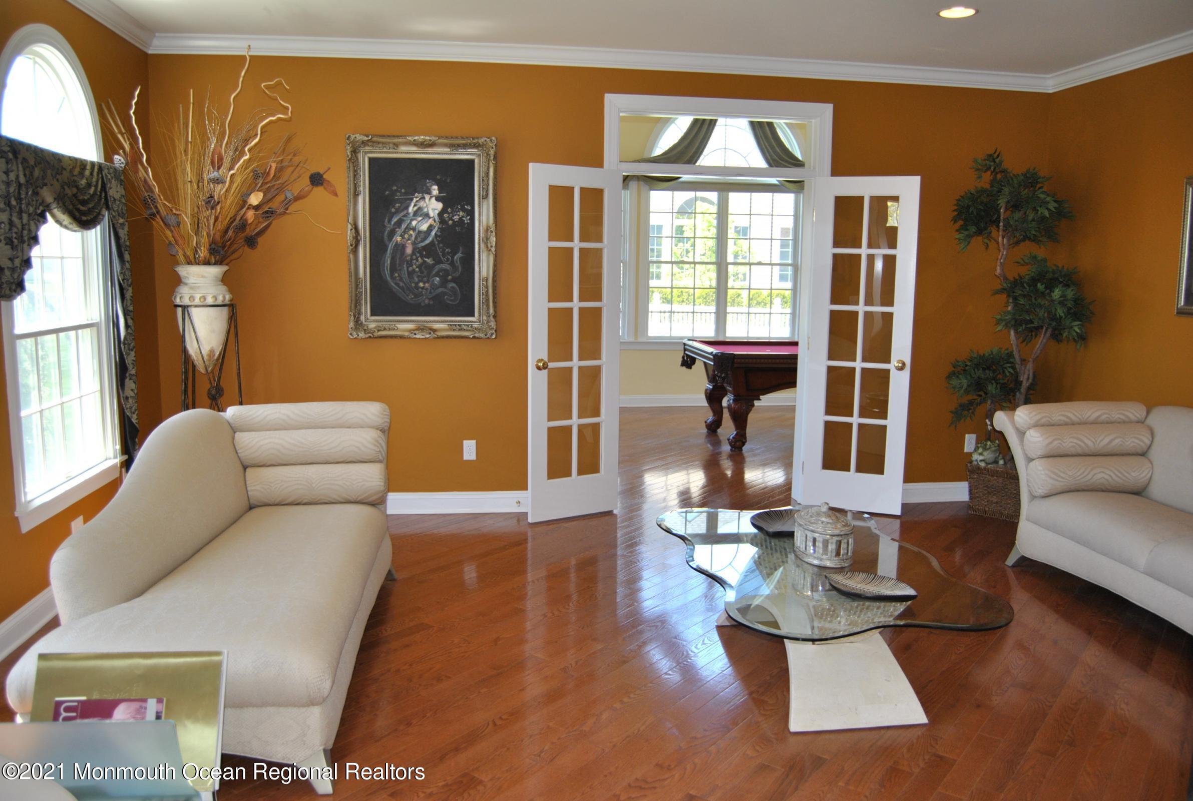 2 Hanging Rock Road Freehold, NJ 07728 - Photo 4 of 55 a living room with furniture fireplace and wooden floor