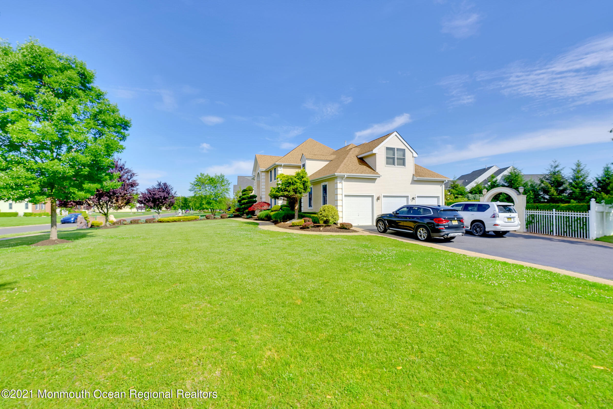 2 Hanging Rock Road Freehold, NJ 07728 - Photo 46 of 55 a front view of a house with a garden and trees