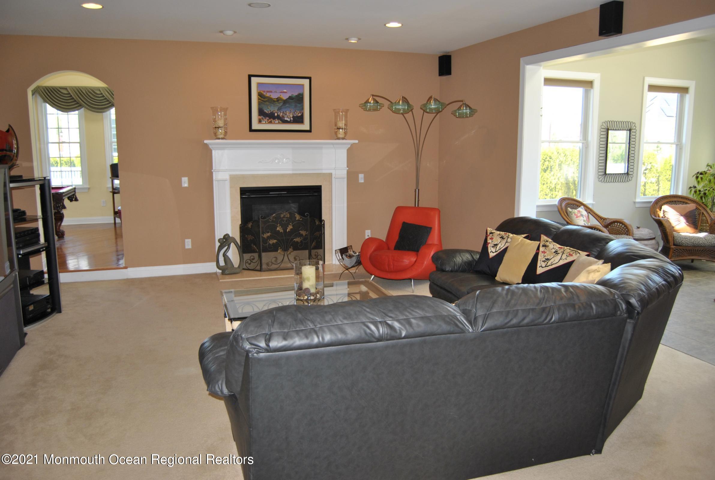 2 Hanging Rock Road Freehold, NJ 07728 - Photo 9 of 55 a living room with furniture and a fireplace