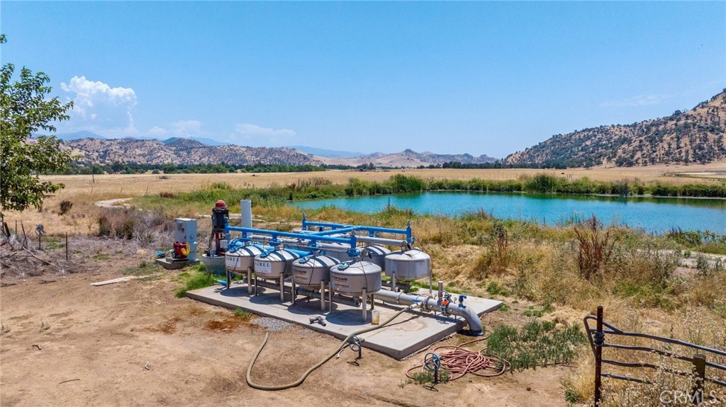 19400 398th Woodlake, CA 93286 - Photo 48 of 51 a view of a lake with a table and chairs