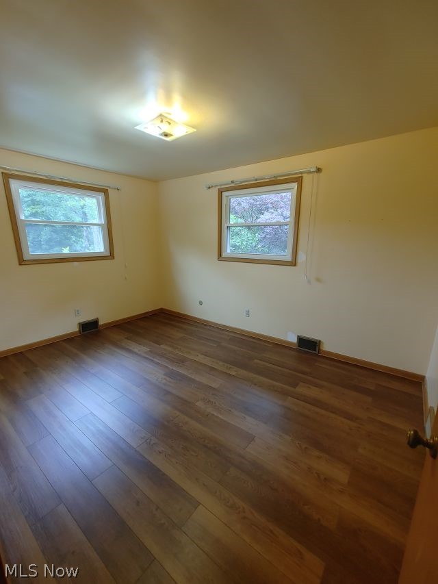 2211 Devonshire Road Northwest Canton, OH 44708 - Photo 24 of 36 Bedroom 4 Spare room with a healthy amount of sunlight and wood-type flooring