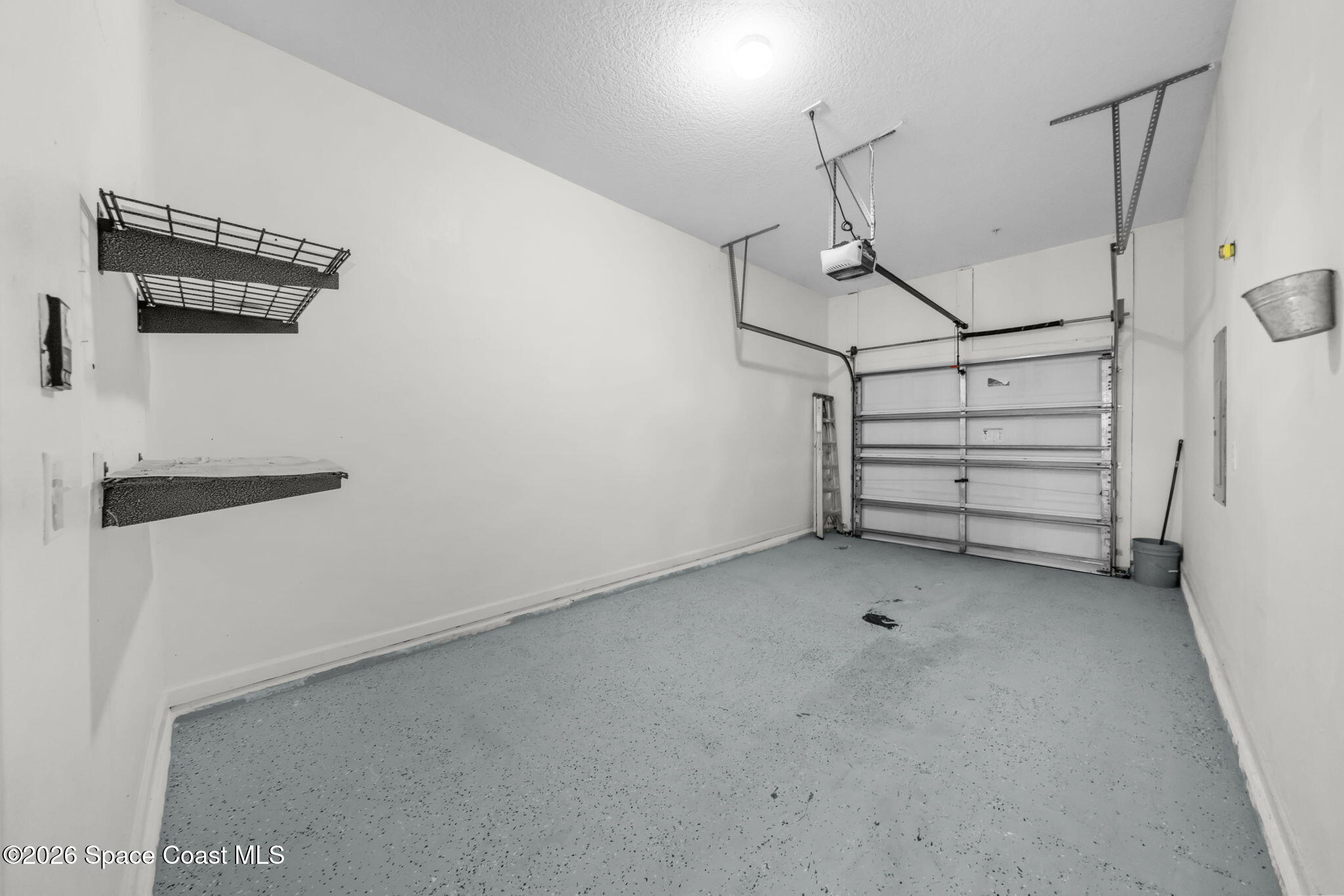 4056 Meander Place, Unit 104 Rockledge, FL 32955 - Photo 17 of 25 a view of a room with racks on the wall