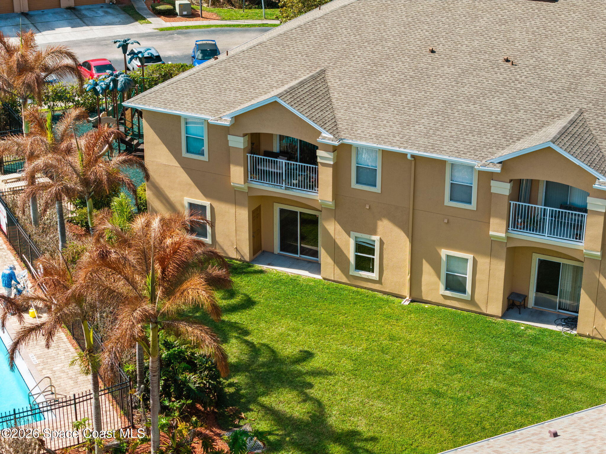 4056 Meander Place, Unit 104 Rockledge, FL 32955 - Photo 18 of 25 a front view of a house with a yard