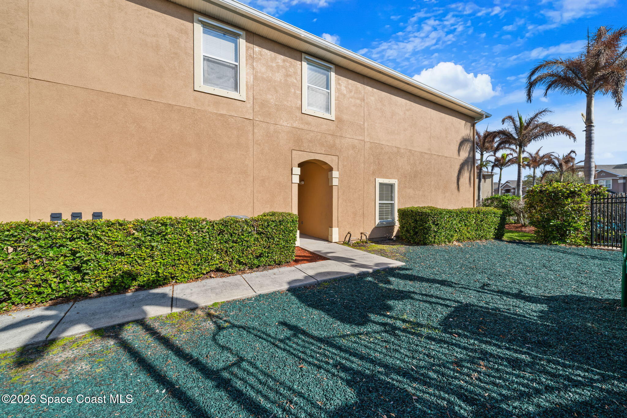 4056 Meander Place, Unit 104 Rockledge, FL 32955 - Photo 21 of 25 a front view of a house with garden