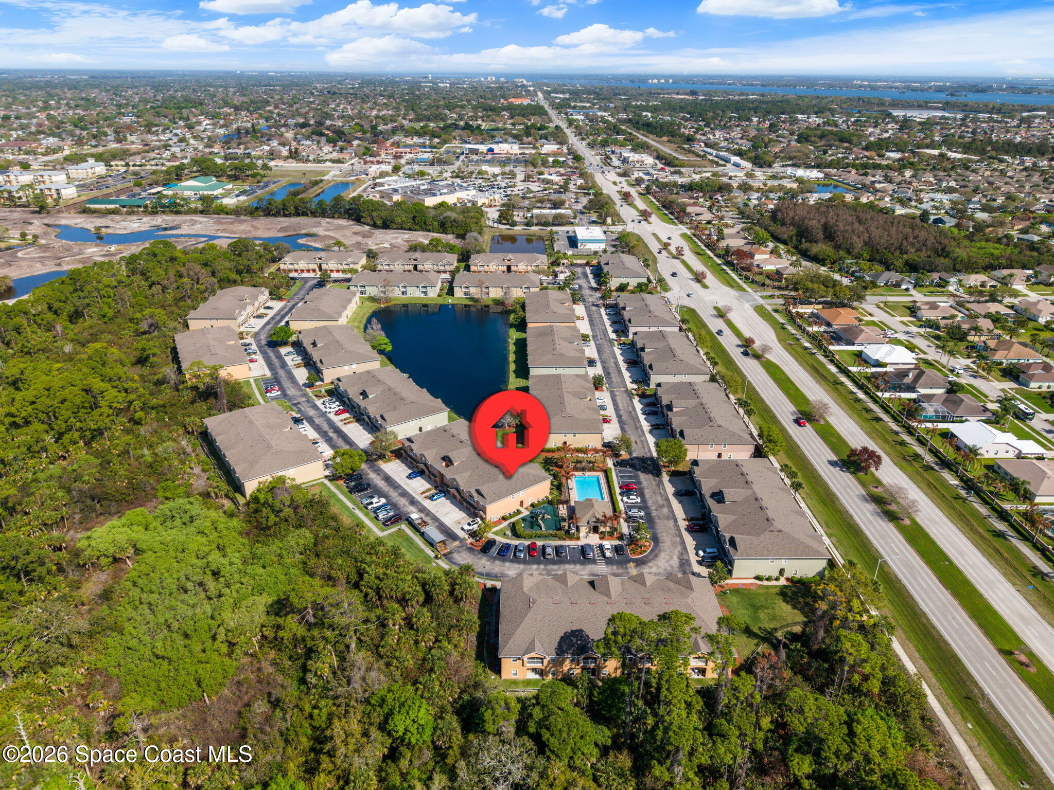 4056 Meander Place, Unit 104 Rockledge, FL 32955 - Photo 22 of 25 an aerial view of residential houses with outdoor space and parking
