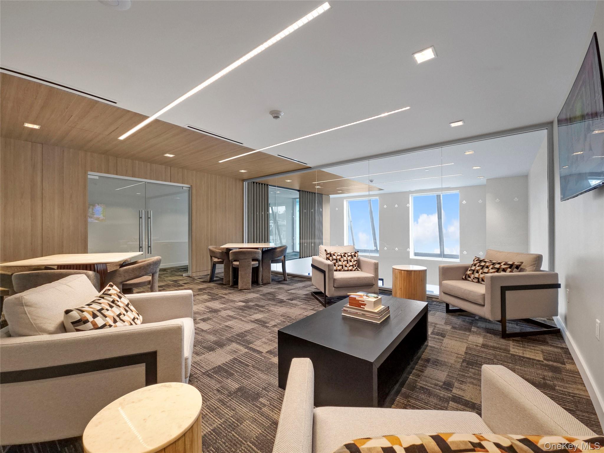 218 Middle Neck Road, Unit 207 Great Neck, NY 11021 - Photo 12 of 32 a living room with furniture and wooden floor