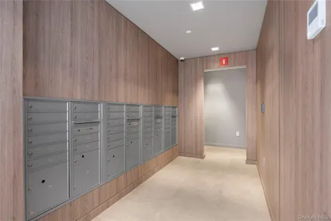 a view of an empty room with kitchen