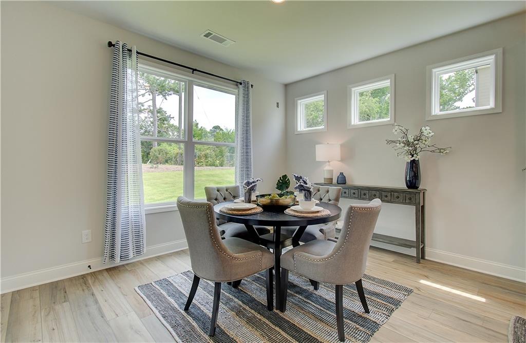 31 Butternut Way Auburn, GA 30011 - Photo 8 of 35 a view of a dining room with furniture and wooden floor