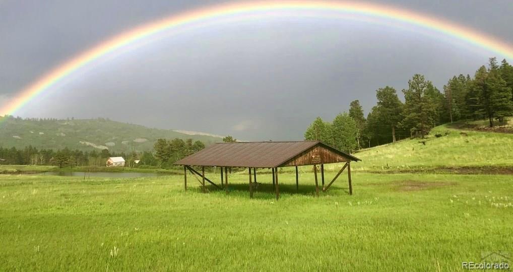 10401 Windy Ridge Road Aguilar, CO 81020 - Photo 14 of 24 a view of an chairs and table on the green field
