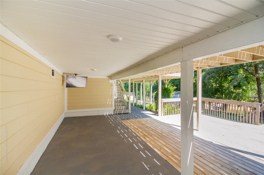 4518 Cove Trail Anderson, SC 29621 - Photo 42 of 49 Sheltered outdoor living transitions seamlessly onto an expansive open-air wooden deck.