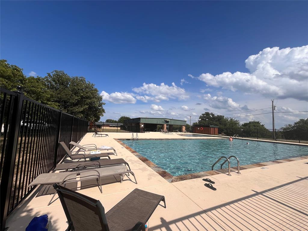 381 Ranchview Court Bowie, TX 76230 - Photo 7 of 7 Community swimming pool featuring a large rectangular design with integrated steps