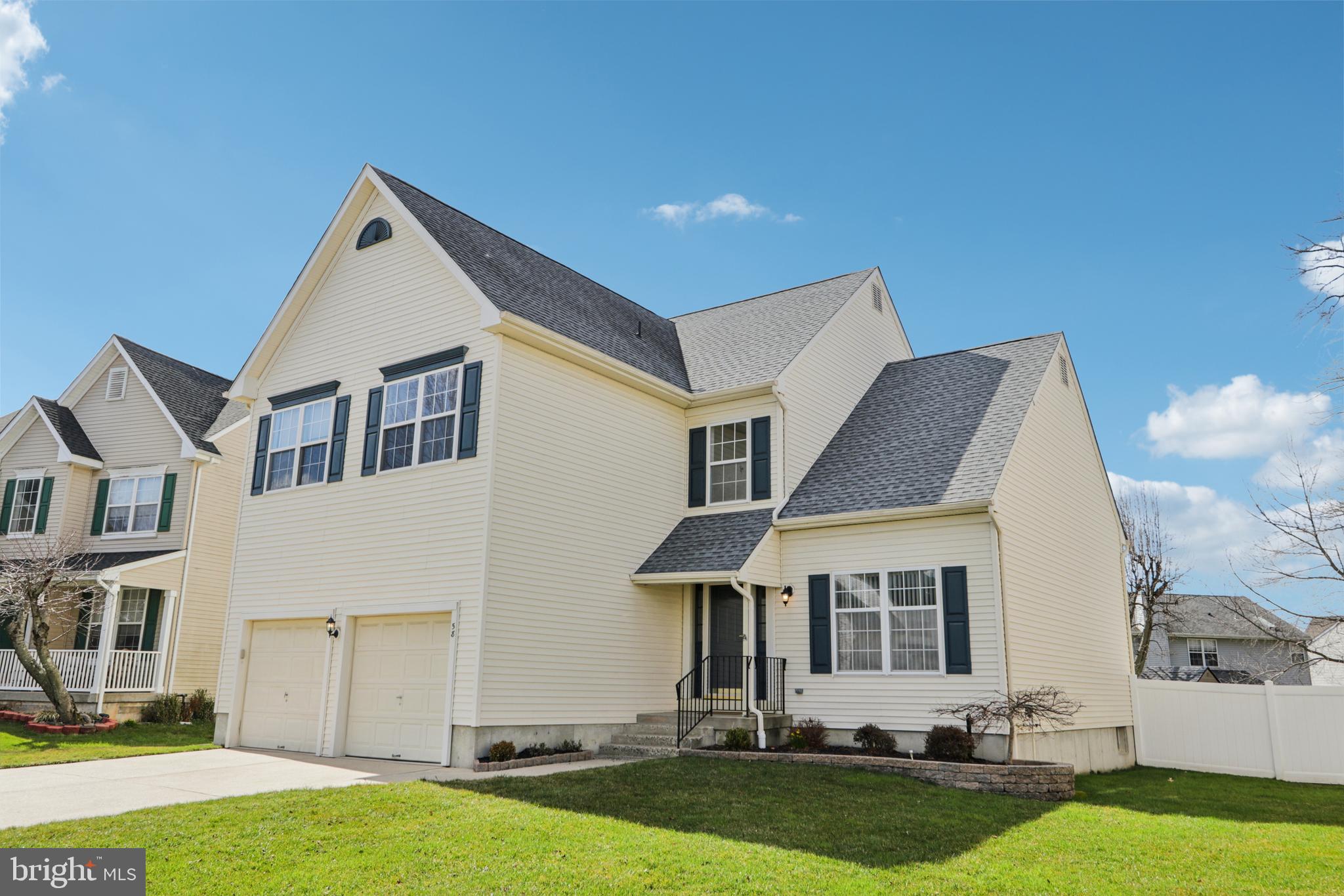 58 Watson Drive Mount Laurel, NJ 08054 - Photo 1 of 56 a front view of a house with a yard and garage