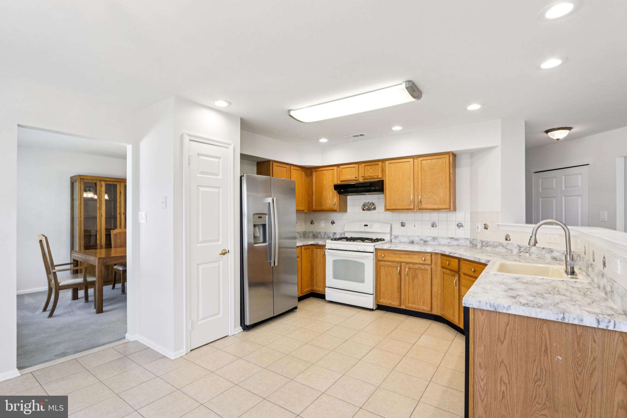 58 Watson Drive Mount Laurel, NJ 08054 - Photo 14 of 56 a large kitchen with stainless steel appliances granite countertop a refrigerator and a sink