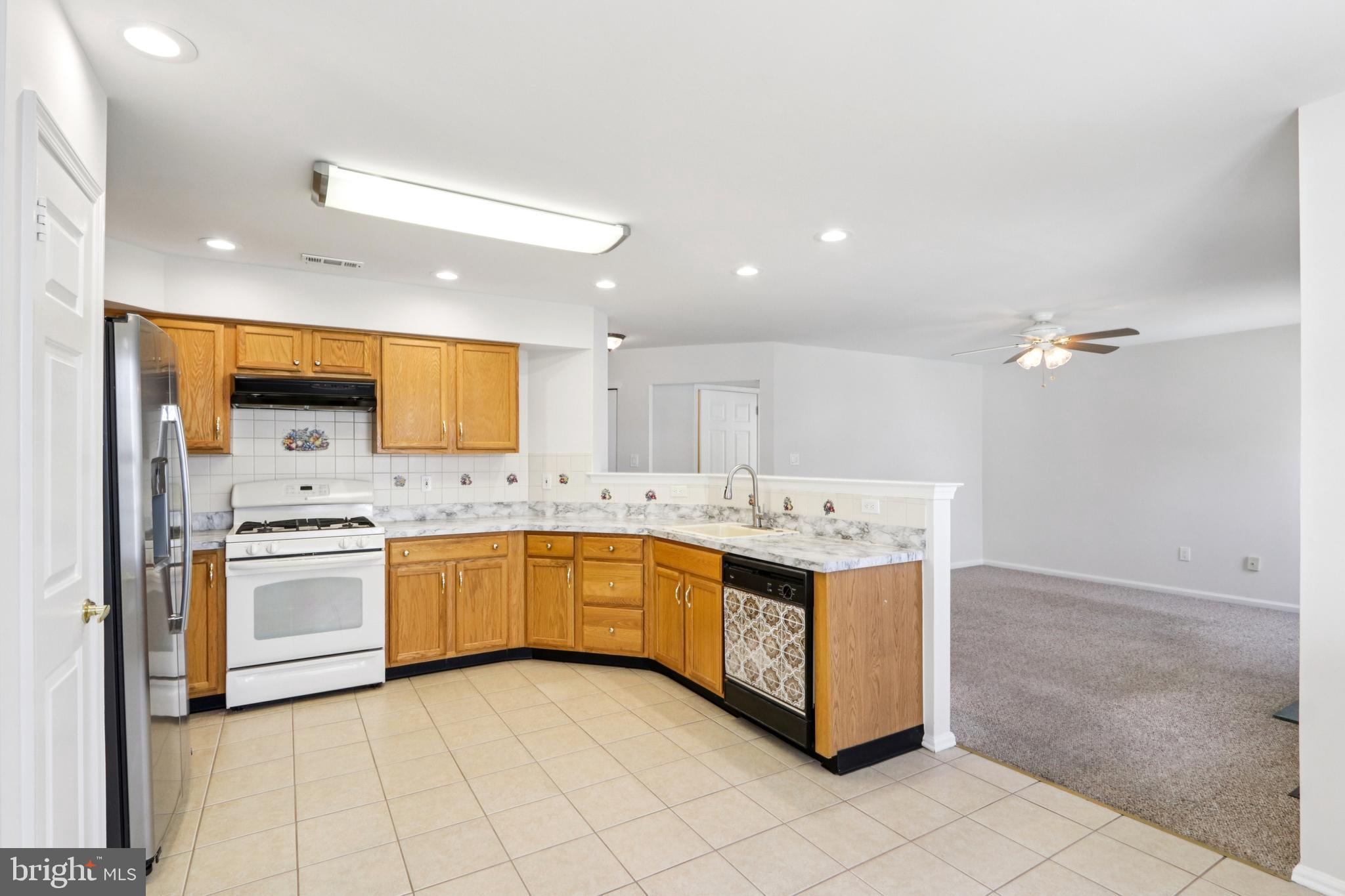 58 Watson Drive Mount Laurel, NJ 08054 - Photo 15 of 56 a kitchen with stainless steel appliances granite countertop a stove and a sink