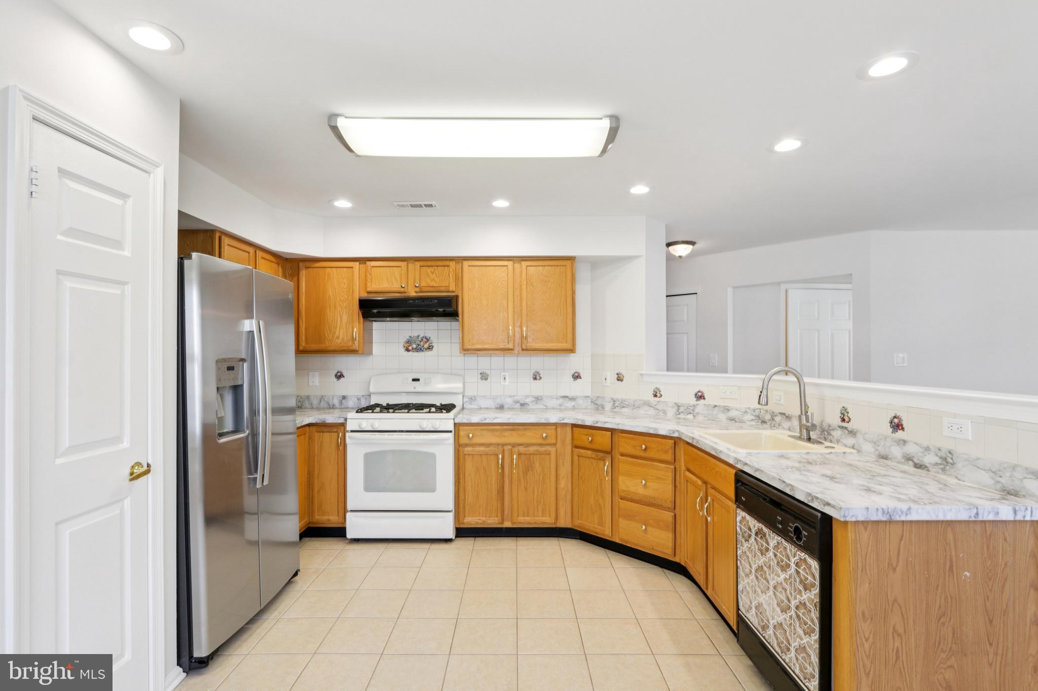 58 Watson Drive Mount Laurel, NJ 08054 - Photo 16 of 56 a large kitchen with stainless steel appliances granite countertop a sink and cabinets